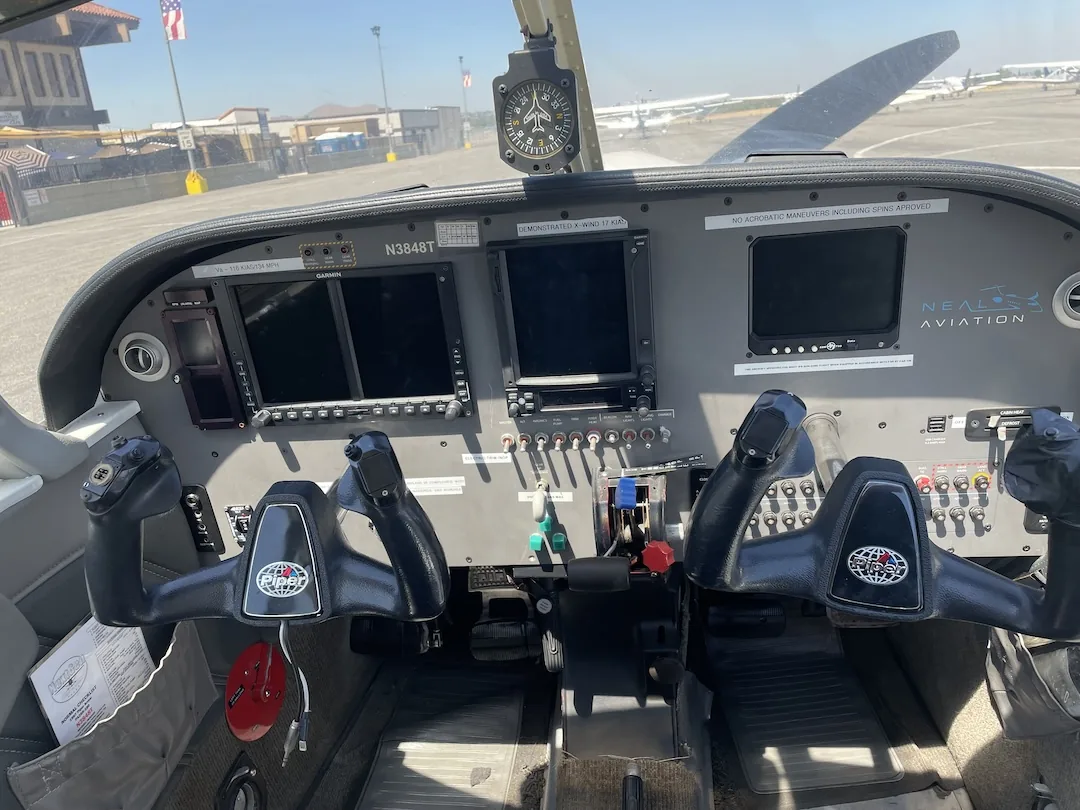 Glass instrument panel inside a Cessna 172 during a Southern California training flight